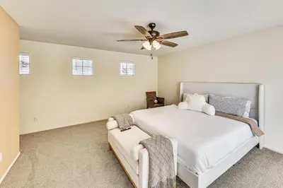 a bedroom with a bed and a ceiling fan at Spacious Menifee Home with Patio, 9 Mi to Lake! in Menifee