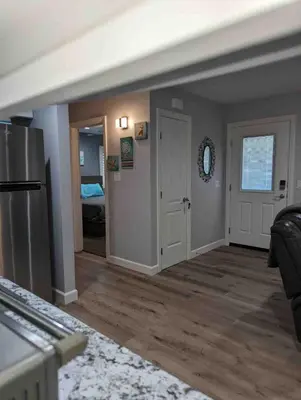 an empty room with a kitchen and a living room at Alpine's Gorgeous Guest Home in Alpine