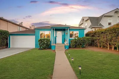 a house with a blue house with a lawn at 10 Min to the Beach Colorful Home Huge Yard in San Diego