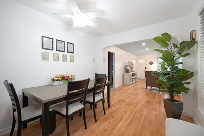 a dining room with a table and chairs at 10 Min to the Beach Colorful Home Huge Yard in San Diego