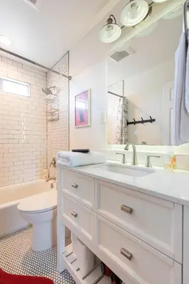 a white bathroom with a sink and a toilet at Cozy Room with Hot Tub, Pool, Sauna & Gym Near Beach in Oceanside