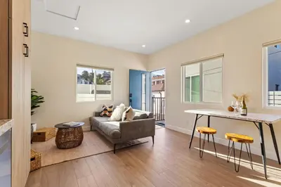 a living room with a couch and a table at Urban Villa in San Diego
