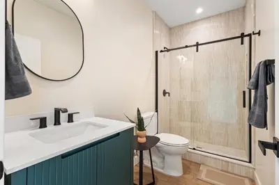 a bathroom with a sink and a toilet and a shower at Urban Villa in San Diego