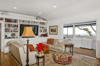 a living room with a couch and a tv at Seaview craftsman with Amazing views in San Diego