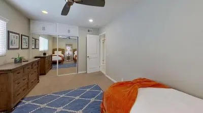 a bedroom with a bed and a bathroom at Salt & Sand II in Newport Beach