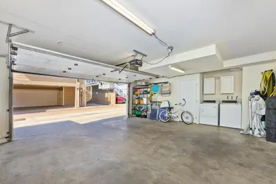 an empty garage with a bike parked in it at Salt & Sand II in Newport Beach