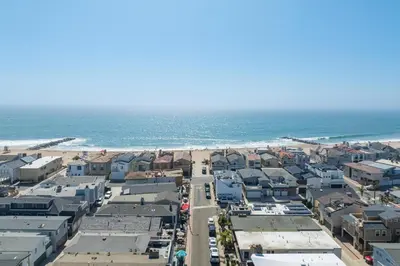 an aerial view of a beach with houses and the ocean at Salt & Sand II in Newport Beach