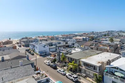 an aerial view of a city with the ocean at Salt & Sand II in Newport Beach