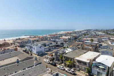 an aerial view of a city with the ocean at Salt & Sand II in Newport Beach