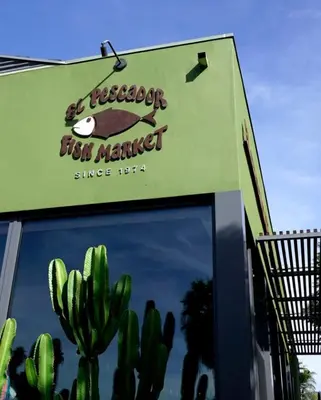 a sign for a fast food market with a cactus at Heart of La Jolla Village cottage in San Diego