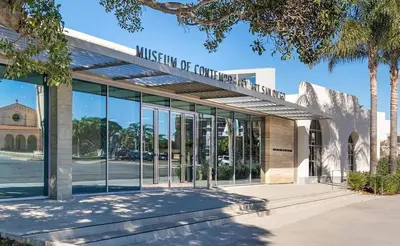 a building with a sign on the front of it at Heart of La Jolla Village cottage in San Diego