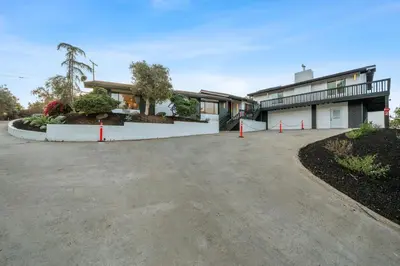 a house with a driveway in front of it at Entire Private Home with 2 Bedrooms 1 Bathroom, Grand View, King Bed, Spacious, Parking, Available Now in El Cajon