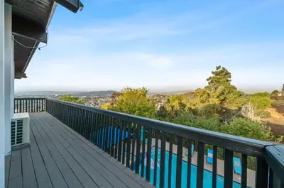 a balcony with a view of a swimming pool at Entire Private Home with 2 Bedrooms 1 Bathroom, Grand View, King Bed, Spacious, Parking, Available Now in El Cajon