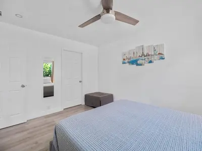 a bedroom with a bed and a ceiling fan at Recently updated home close to La Jolla & Del Mar- 2 bedrooms home in San Diego