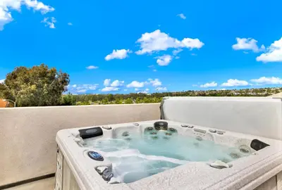 a hot tub on the back of a balcony at Oceanview Oasis with Roofdeck Hot Tub in Carlsbad