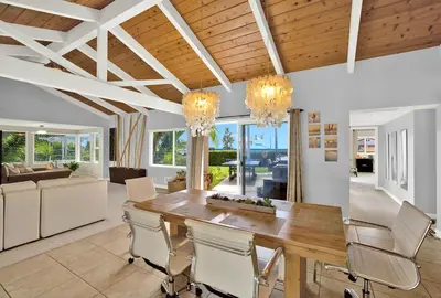 a dining room with a wooden table and chairs at Oceanview Oasis with Roofdeck Hot Tub in Carlsbad
