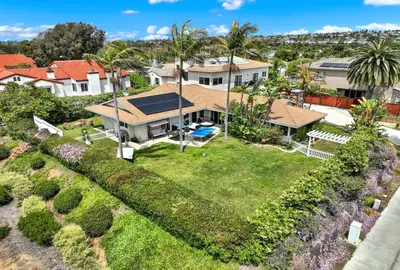 an aerial view of a house with a yard at Oceanview Oasis with Roofdeck Hot Tub in Carlsbad
