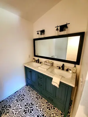 a bathroom with a sink and a large mirror at Temecula Wine Country Ranch with 200 year old oaks in Temecula