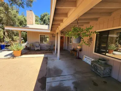 a porch of a house with a patio at Temecula Wine Country Ranch with 200 year old oaks in Temecula