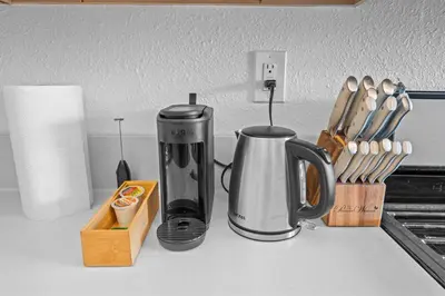 a coffeemaker and a coffee maker on a kitchen counter at Modern Eclectic 2BR Near Petco, Balboa Park & Zoo in San Diego