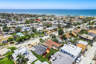 an aerial view of a city with houses and the ocean at 2BR-2 mins to Ocean-Sleeps 8-Pets in San Diego