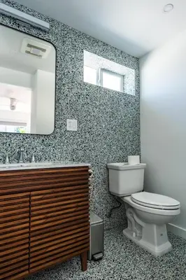 a bathroom with a toilet and a mirror at Simple La Jolla Epic bungalow #7 in San Diego