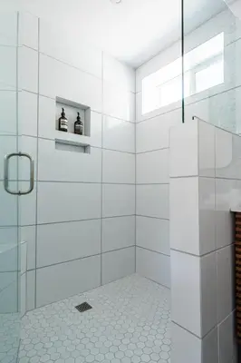 a white bathroom with a shower with two bottles at Simple La Jolla Epic bungalow #7 in San Diego