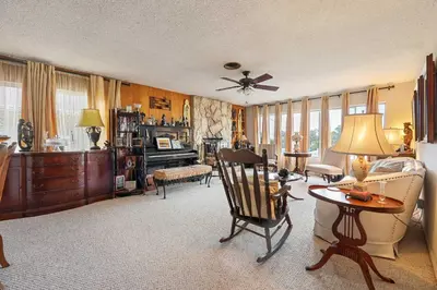 a living room filled with furniture and a ceiling fan at A Visit to Grandma's House in San Diego