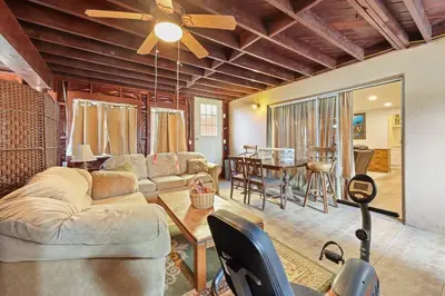 a living room with a couch and a table at Stay at Grandmas Entire Home with Yard & Balcony in San Diego