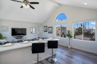 a living room with a table and chairs at Walk to Ocean Beach Stylish 2BR Apt with Patio in San Diego
