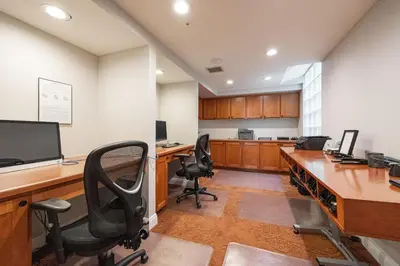 an office with two desks with chairs and a computer at Casita Balboa Modern 1 BR close to Balboa Park in San Diego