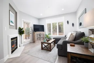 a living room with a couch and a fireplace at Casita Balboa Modern 1 BR close to Balboa Park in San Diego