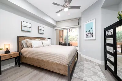 a bedroom with a bed and a ceiling fan at Casita Balboa Modern 1 BR close to Balboa Park in San Diego