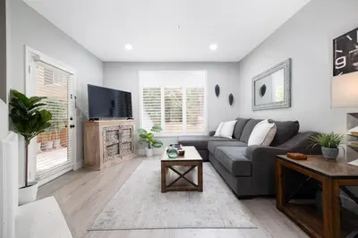 a living room with a couch and a tv at Casita Balboa Modern 1 BR close to Balboa Park in San Diego