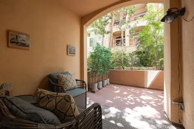 a balcony with chairs and a building with trees at Casita Balboa Modern 1 BR close to Balboa Park in San Diego