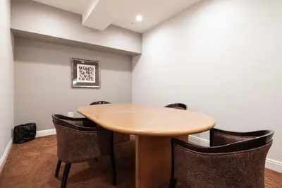 a conference room with a wooden table and chairs at Casita Balboa Modern 1 BR close to Balboa Park in San Diego