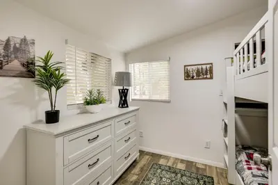 a white room with a dresser with plants on it at Modern Backcountry Retreat! Bike and Hike Mt Laguna in Mount Laguna