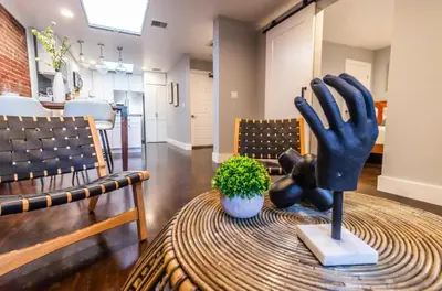 a statue of a hand sitting on a table at Family-Friendly Apartment with Kitchen in San Diego