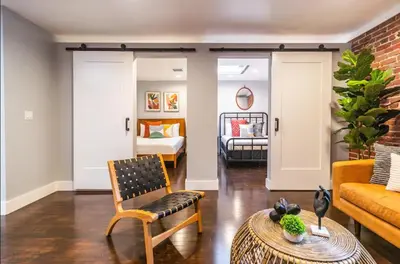 a living room with a couch and a bed at Family-Friendly Apartment with Kitchen in San Diego