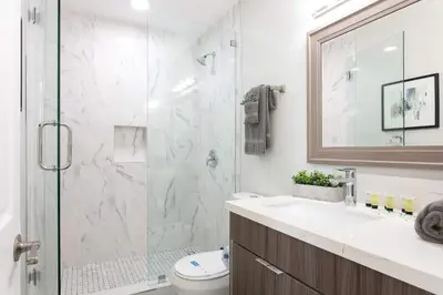 a bathroom with a shower and a sink at Bright 2BR Loft Sleeps 7 with Full Kitchen and Fast WiFi in San Diego