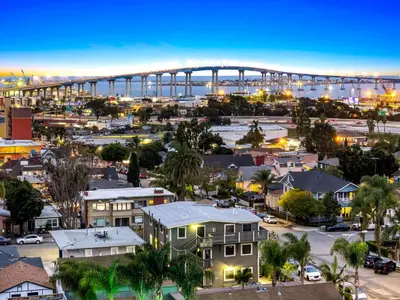 a view of a city with a bridge in the background at Relax in Stylish 1BR Near Gaslamp and Little Italy in San Diego