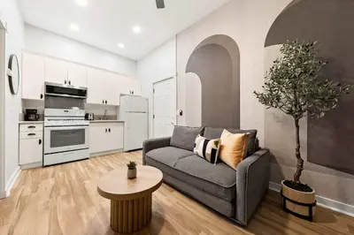 a living room with a couch and a table at Relax in Stylish 1BR Near Gaslamp and Little Italy in San Diego