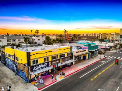 an overhead view of a city street with a yellow building at Historic Apartment with Roof Deck in the Heart of North Park in San Diego