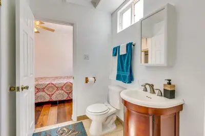 a bathroom with a toilet and a sink and a mirror at 4 Mi to Lake Elsinore Pet-Friendly Adventure Base in Lake Elsinore