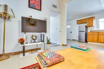 a living room with a tv on the wall at 4 Mi to Lake Elsinore Pet-Friendly Adventure Base in Lake Elsinore