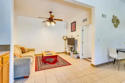 a living room with a couch and a ceiling fan at 4 Mi to Lake Elsinore Pet-Friendly Adventure Base in Lake Elsinore