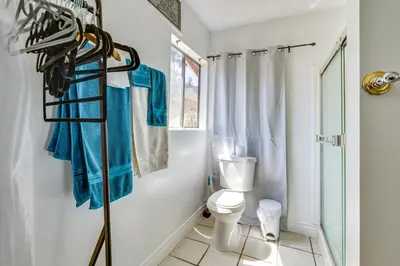 a bathroom with a toilet and a towel rack at 4 Mi to Shore Lake Elsinore Studio with Mtn Views in Lake Elsinore