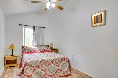 a bedroom with a bed and a ceiling fan at Lake Elsinore Apt 4 Mi to Water Pets Welcome! in Lake Elsinore