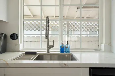 a sink in a kitchen with a window at Near Safari & Beach - Backyard Games - AC - Pet OK in Escondido