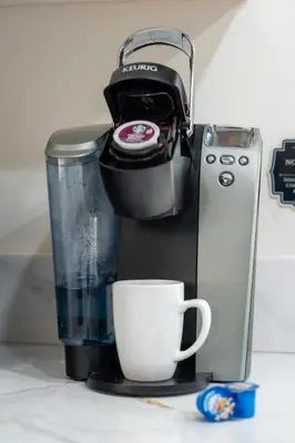 a coffee maker and a cup on a counter at Near Safari & Beach - Backyard Games - AC - Pet OK in Escondido